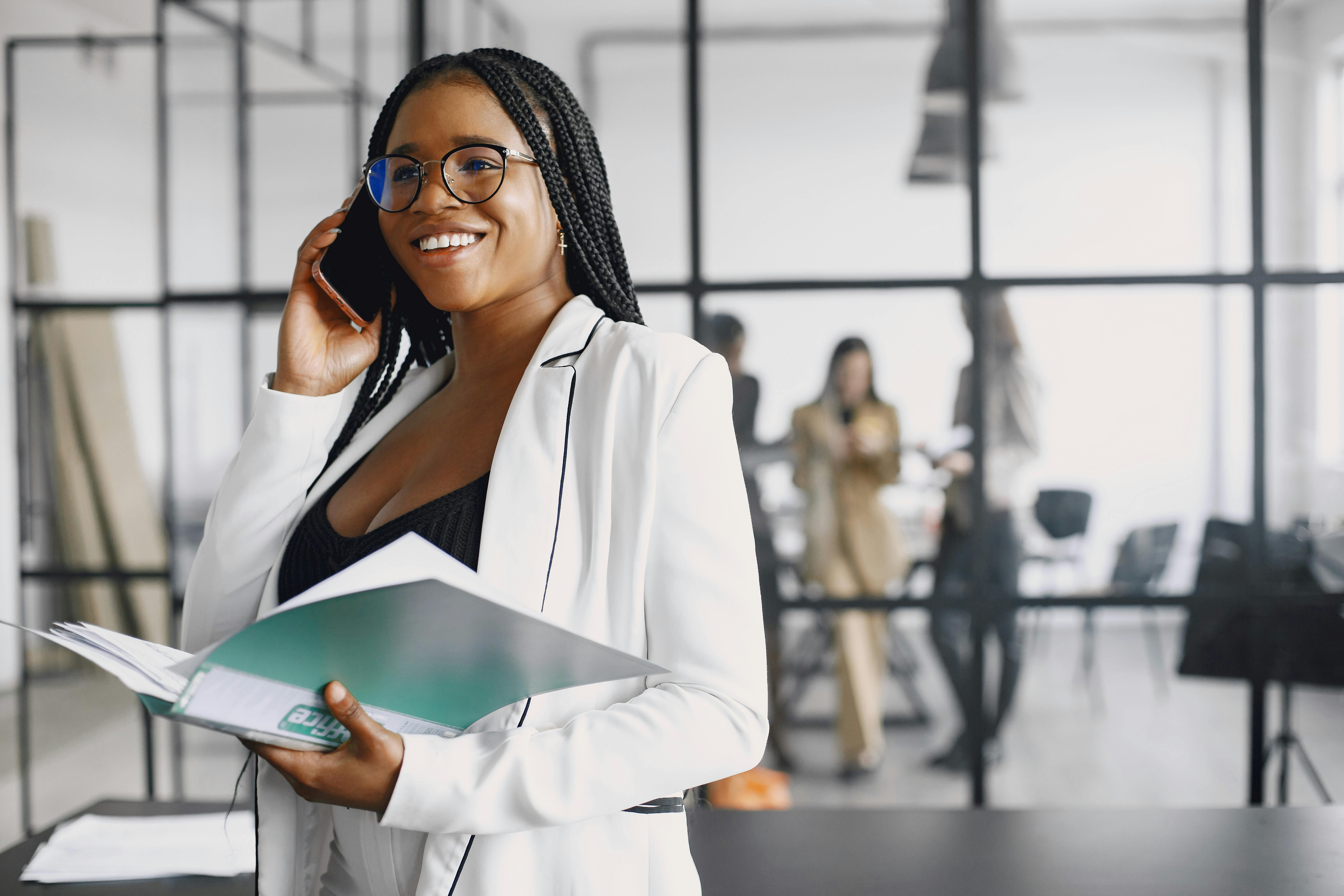 Black woman on the phone with corporate dressing