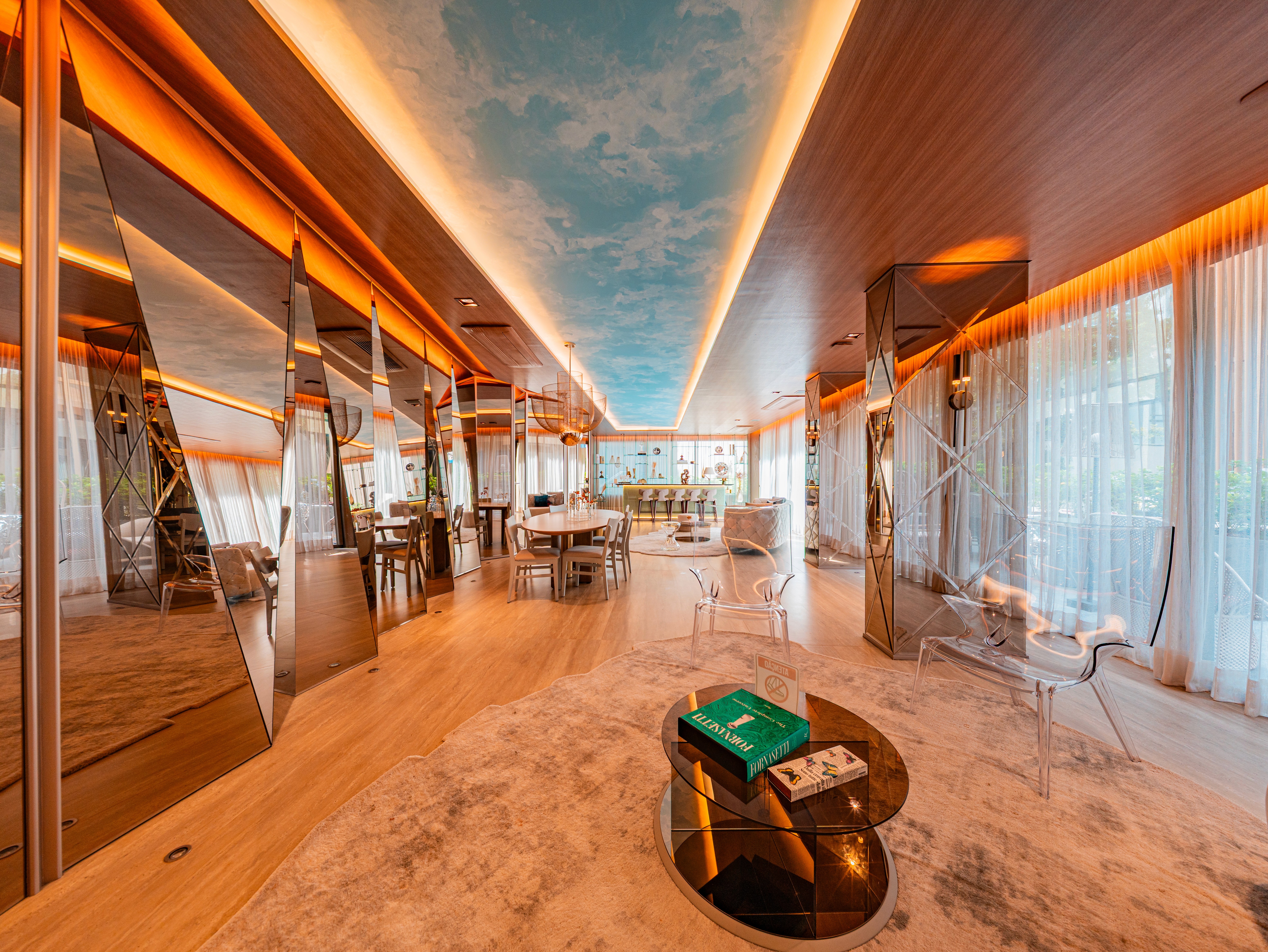 Curved modern skyscraper against a clear blue sky.