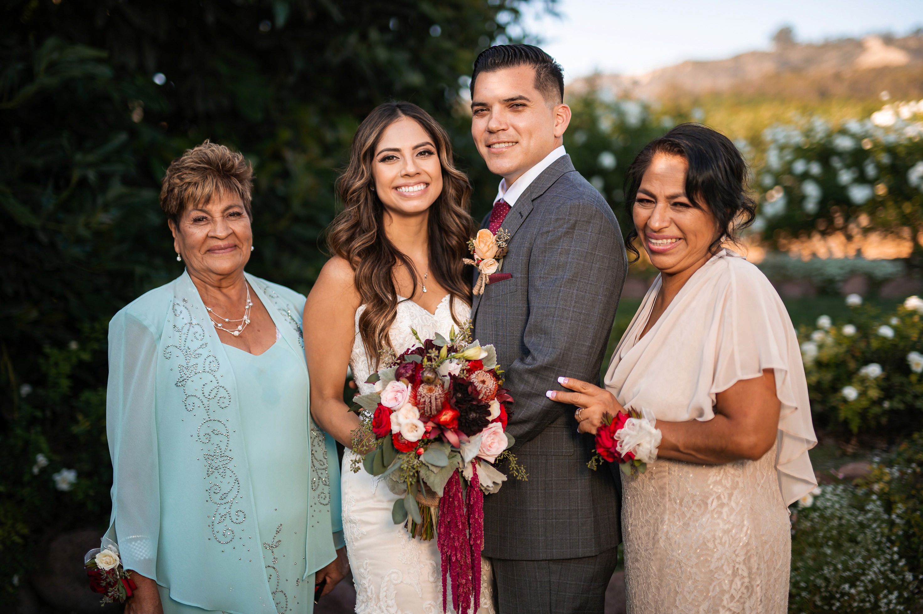 Flat lay wedding details with bouquet, rings, and sparkling bridal heels