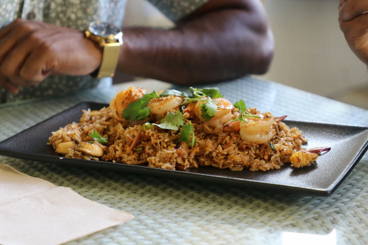 Jollof rice served with grilled prawns