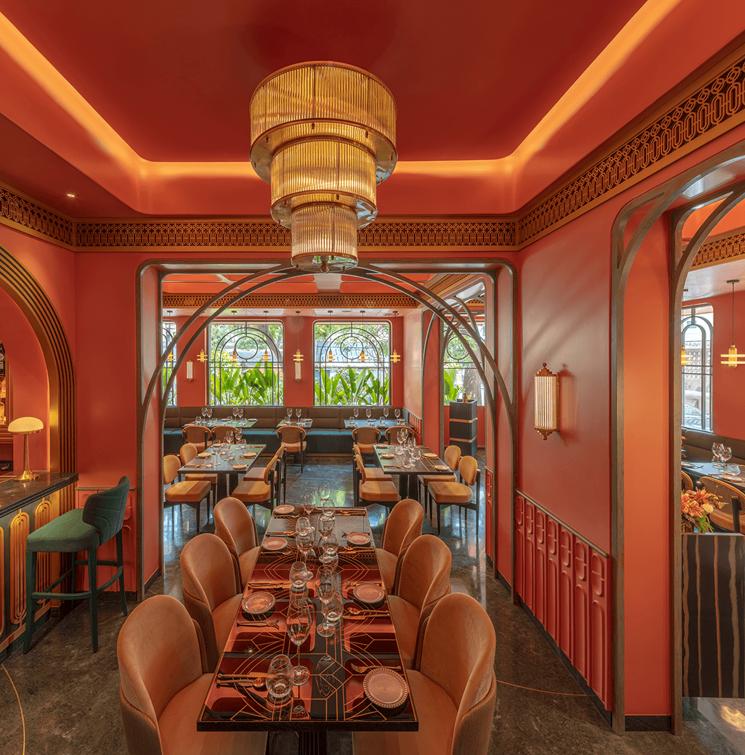 Restaurant exterior with black facade and welcoming atmosphere.