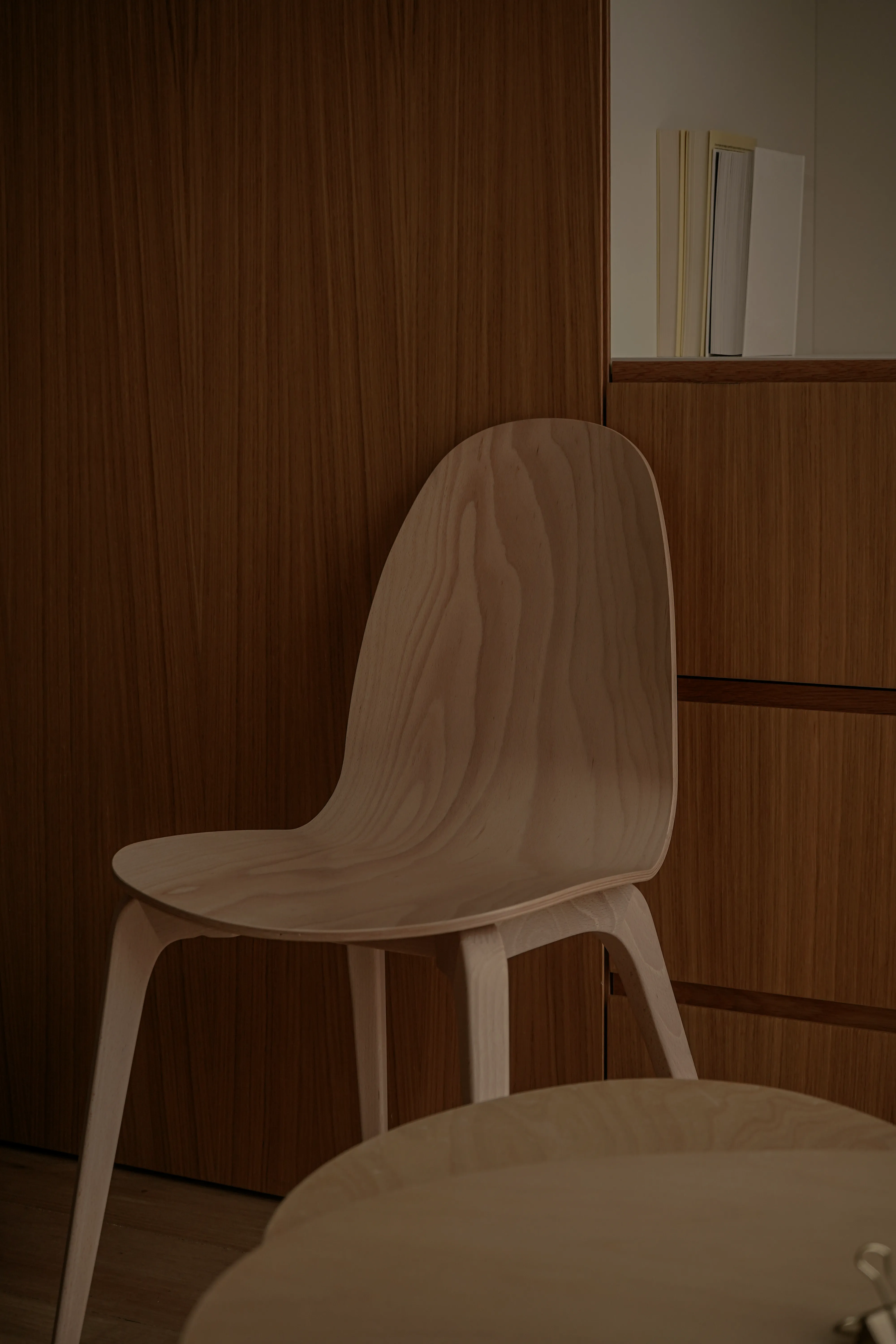 A scene of an oak chair against the wardrobe