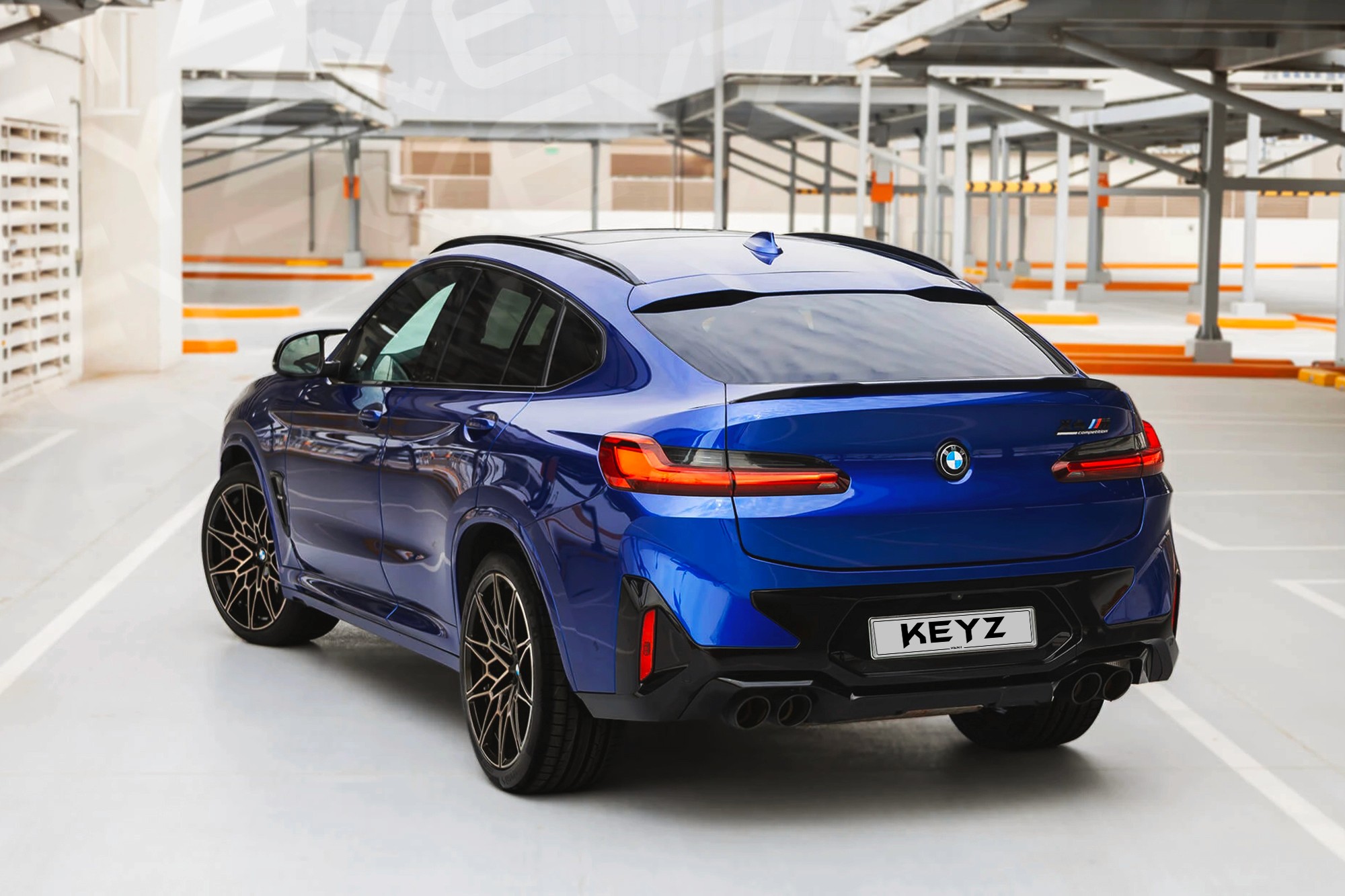 Vue extérieure arrière BMW X4M Competition Bleu – Location SUV à Dubaï | Keyz Rent