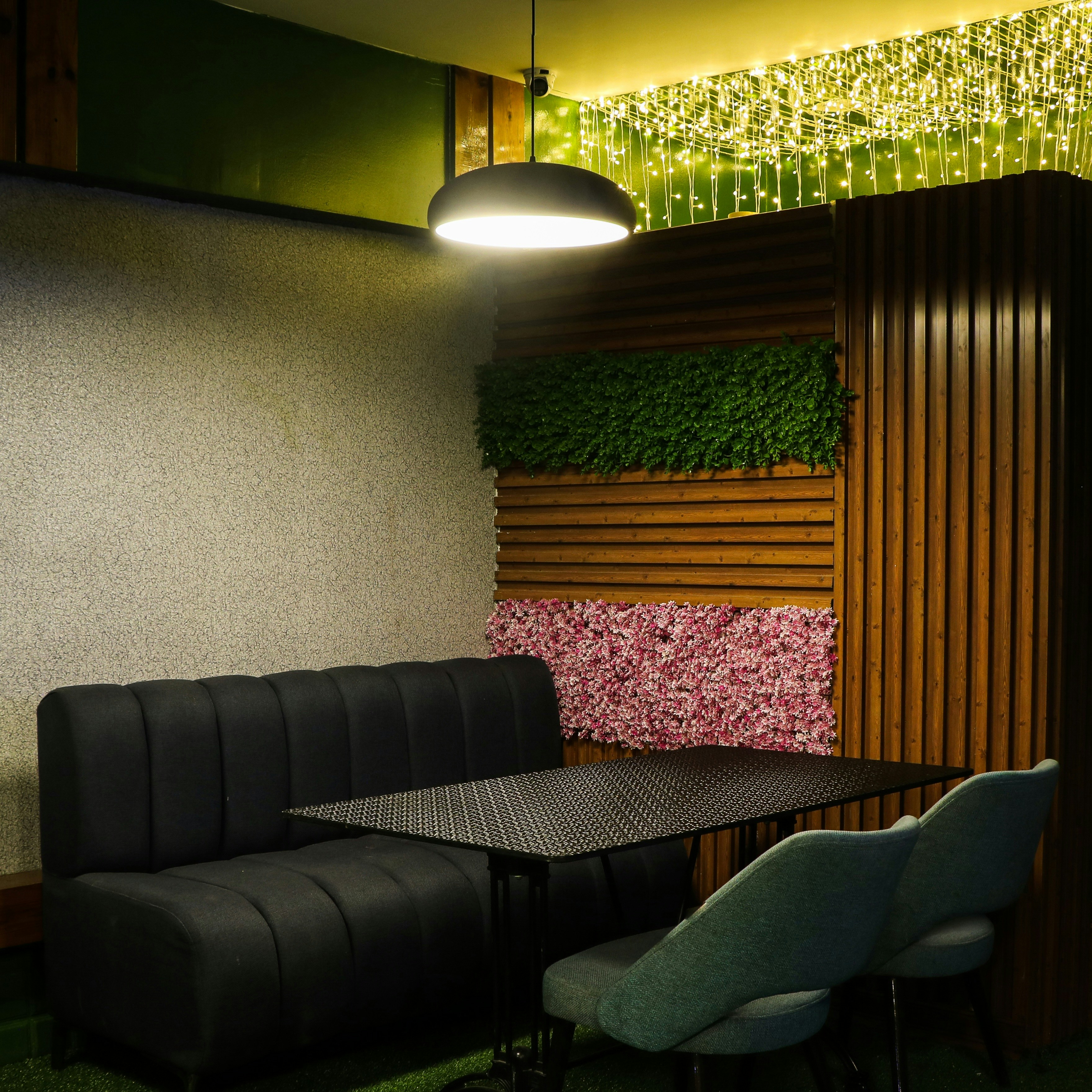 a room with a couch, table and chairs