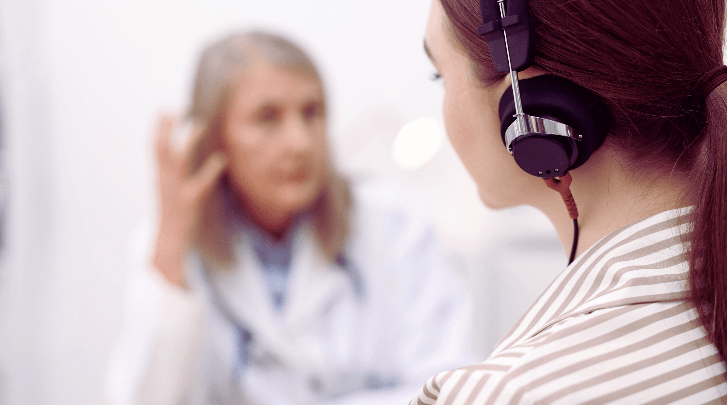 Doctor shows patient medical scan on tablet.