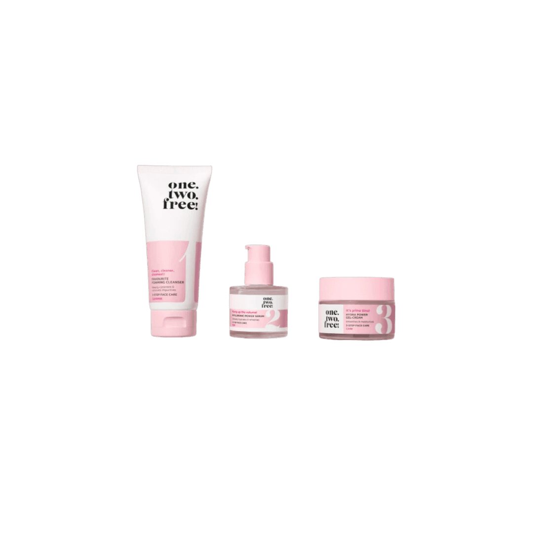 Pink skincare products on a plain white background