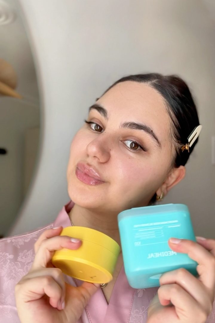 Option B: a creator holding two skincare jars