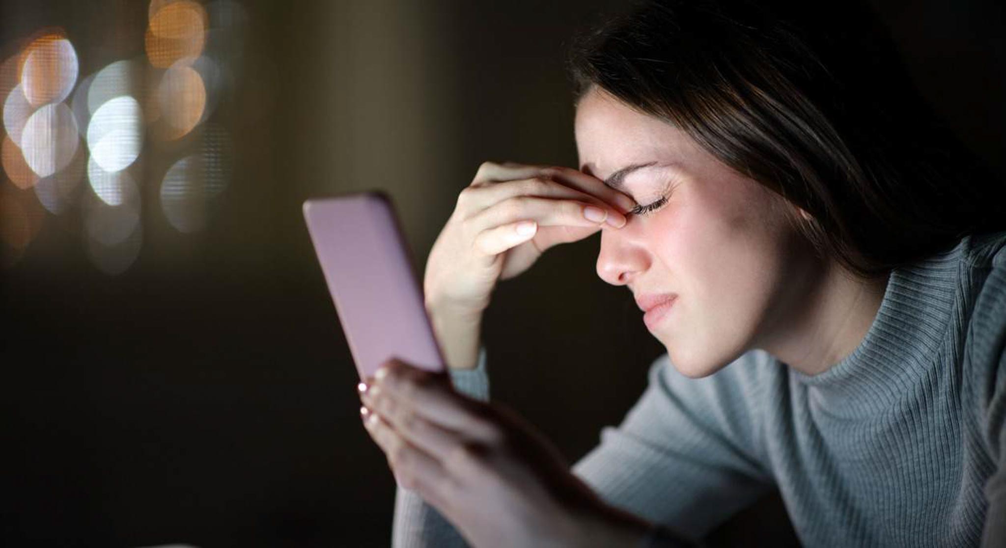 man filming on beach