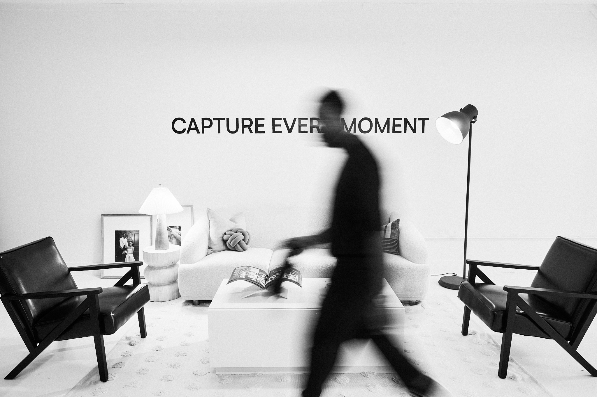 Female barista making coffee with back to camera