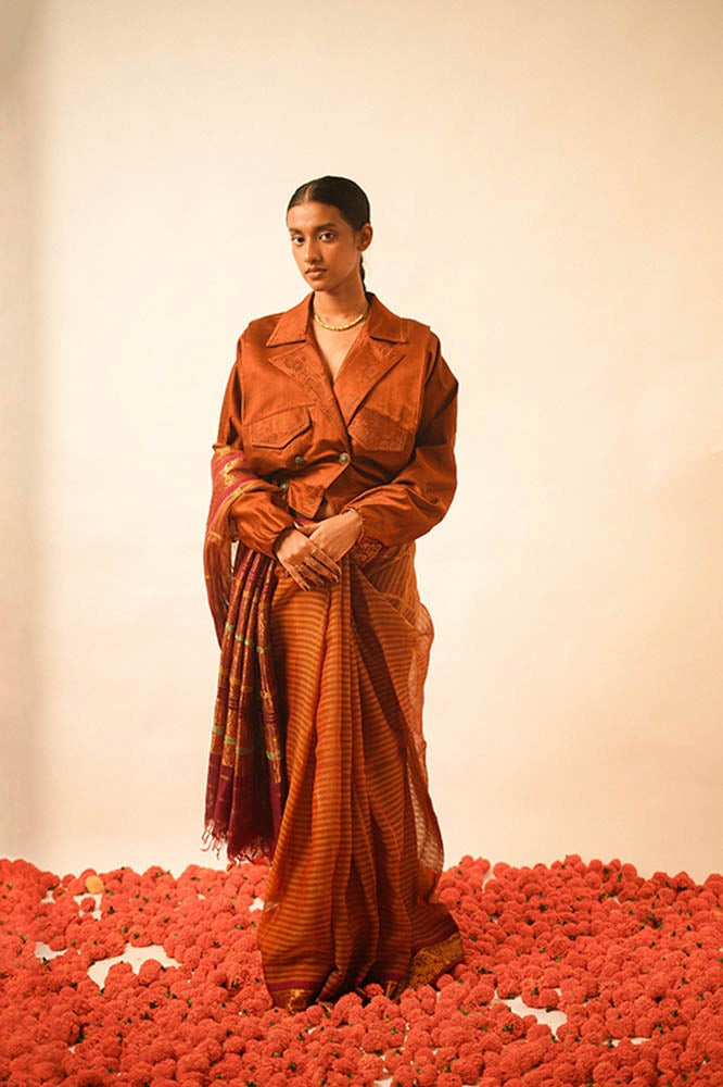 AMBR is our one-of-a-kind cropped two-toned silk brocade reversible bomber, handcrafted by skilled artisans in-house using two vintage silk saris.