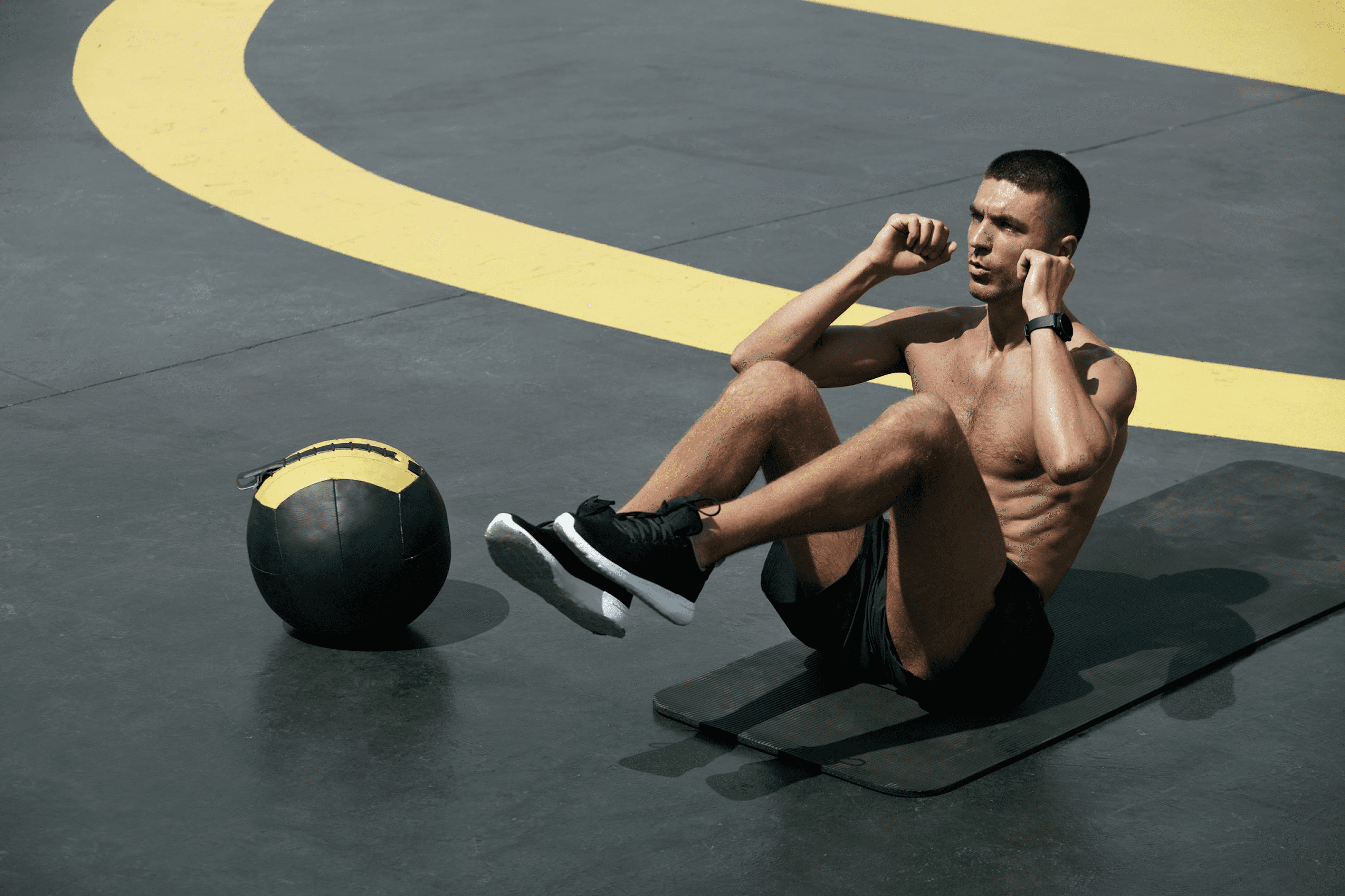 Focused athlete lifting weights in a modern gym, representing dedication and consistency