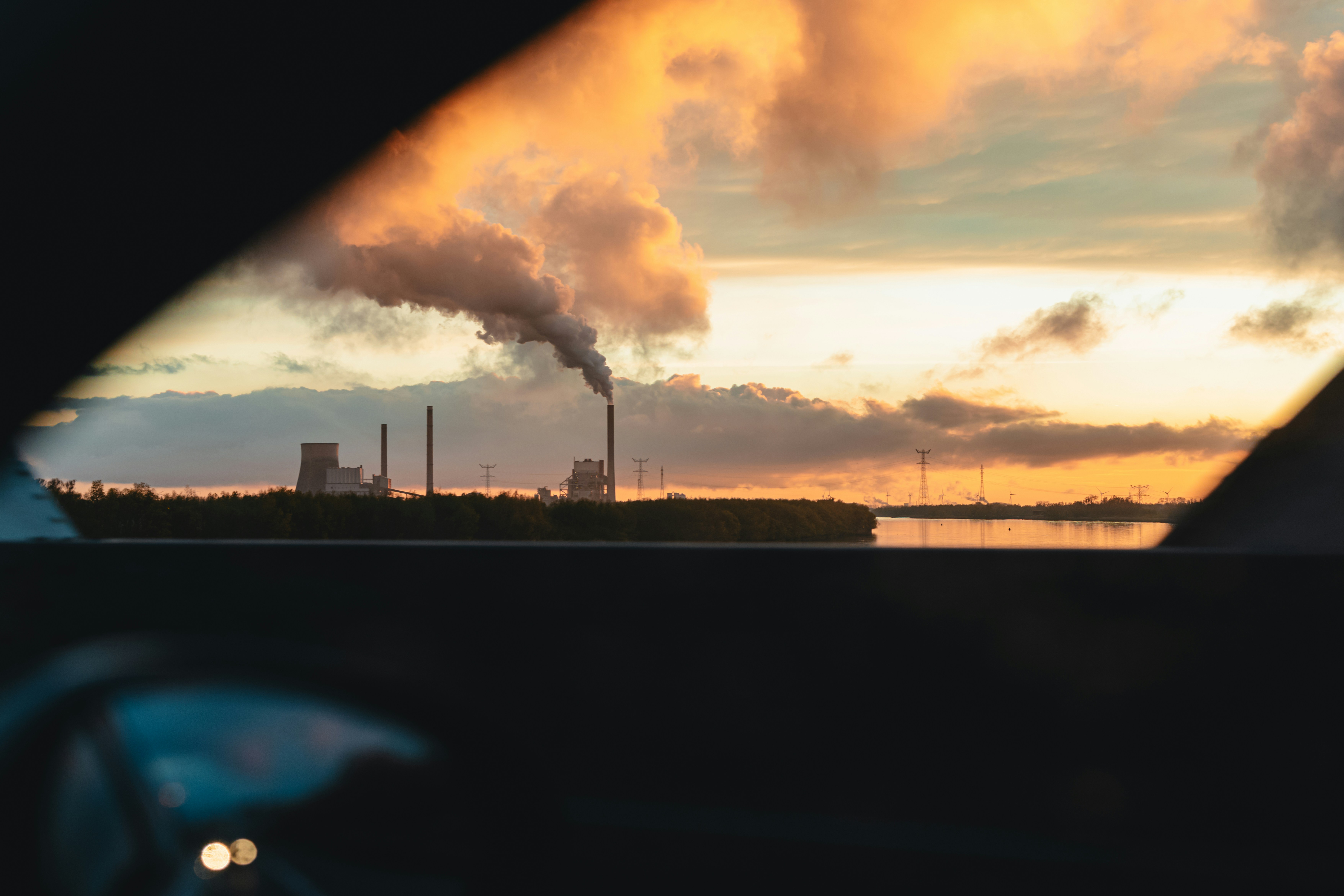 a view of a factory with smoke coming out of it