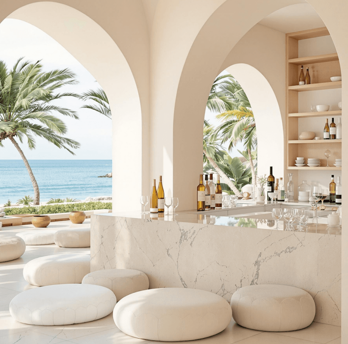 Elegant beachside bar with round seating and ocean view through arches