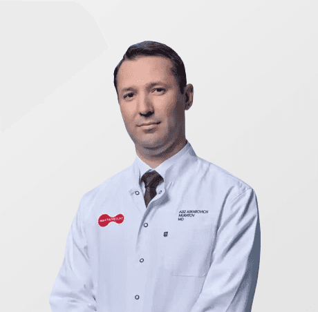 a man in a lab coat standing with his hands on his hips