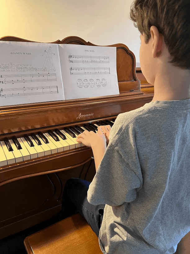 student learning piano