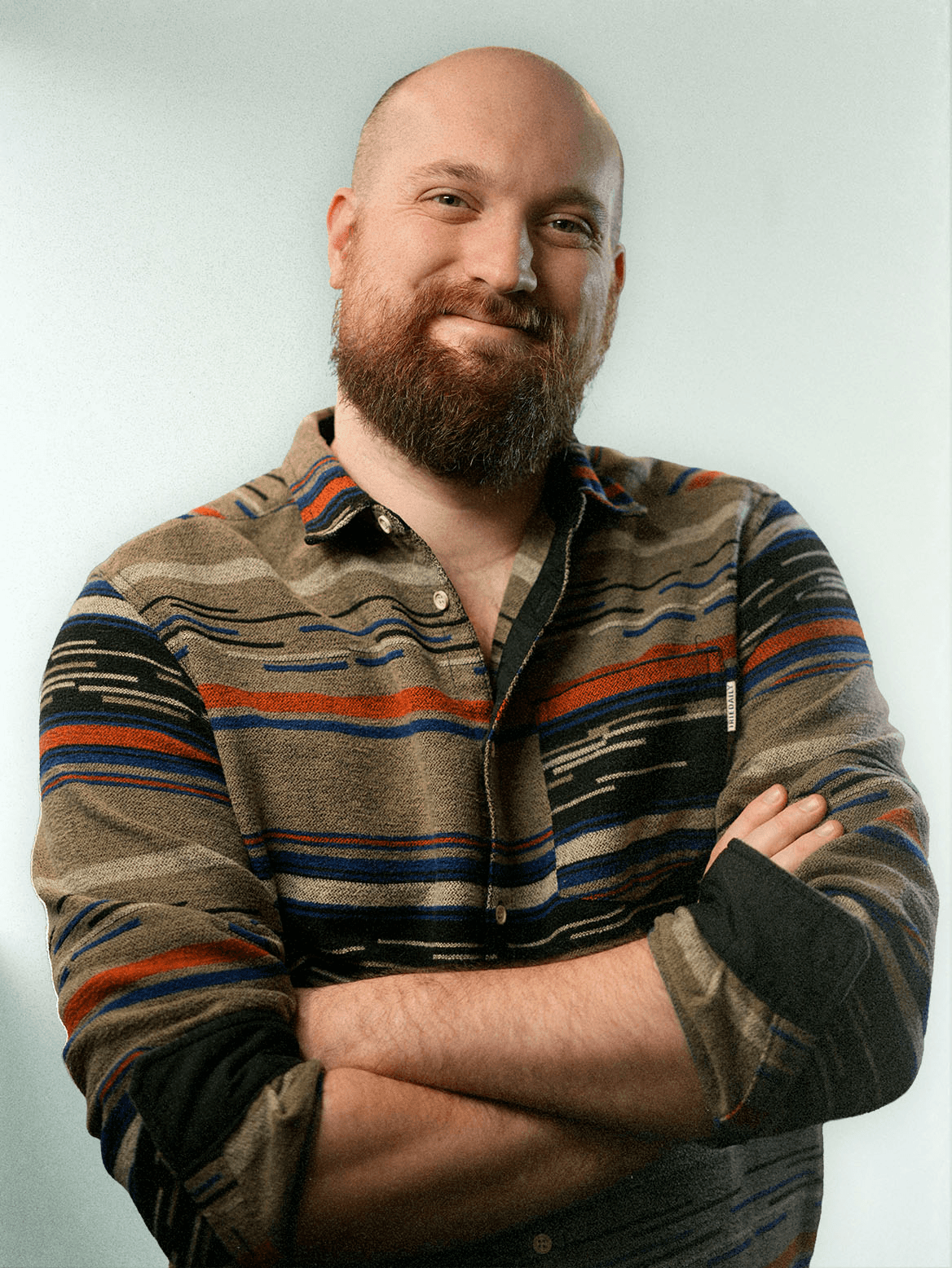 man standing beside wall