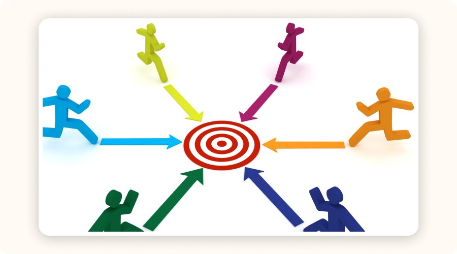 people running toward a red target