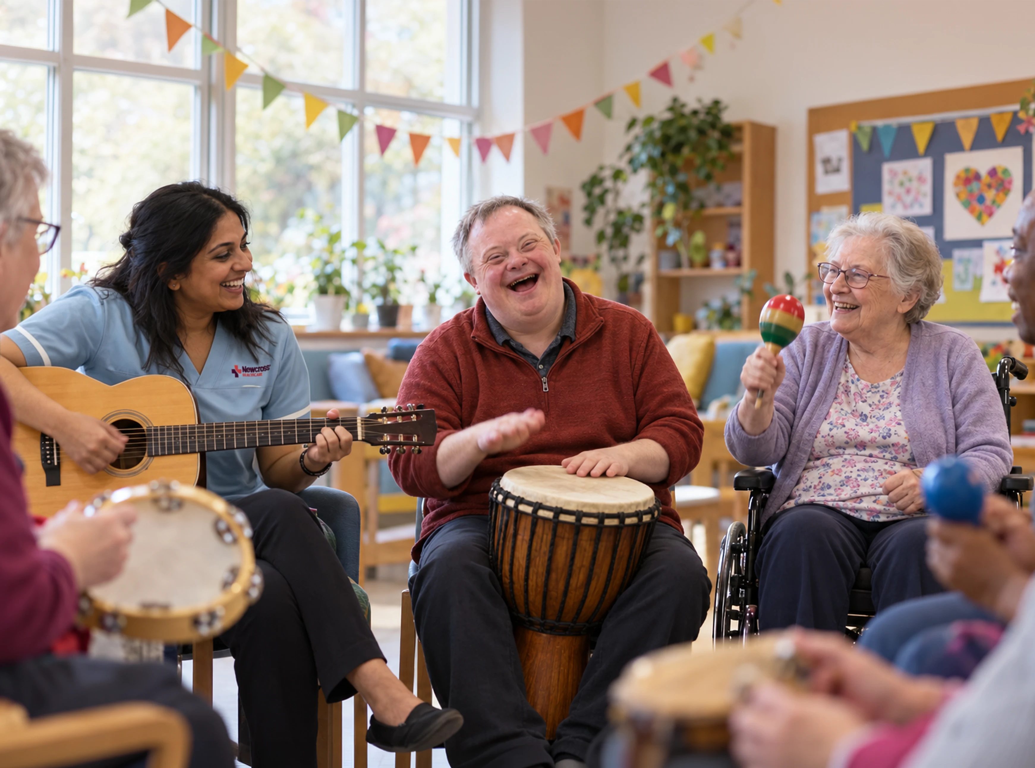 Man with Down’s syndrome laughing while playing a drum during an inclusive music session with adults and an activity specialist at a UK day centre.
