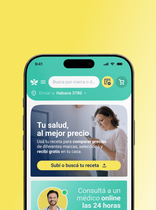 A smiling woman with her arms crossed, standing against a dark green background. She has long, dark hair.