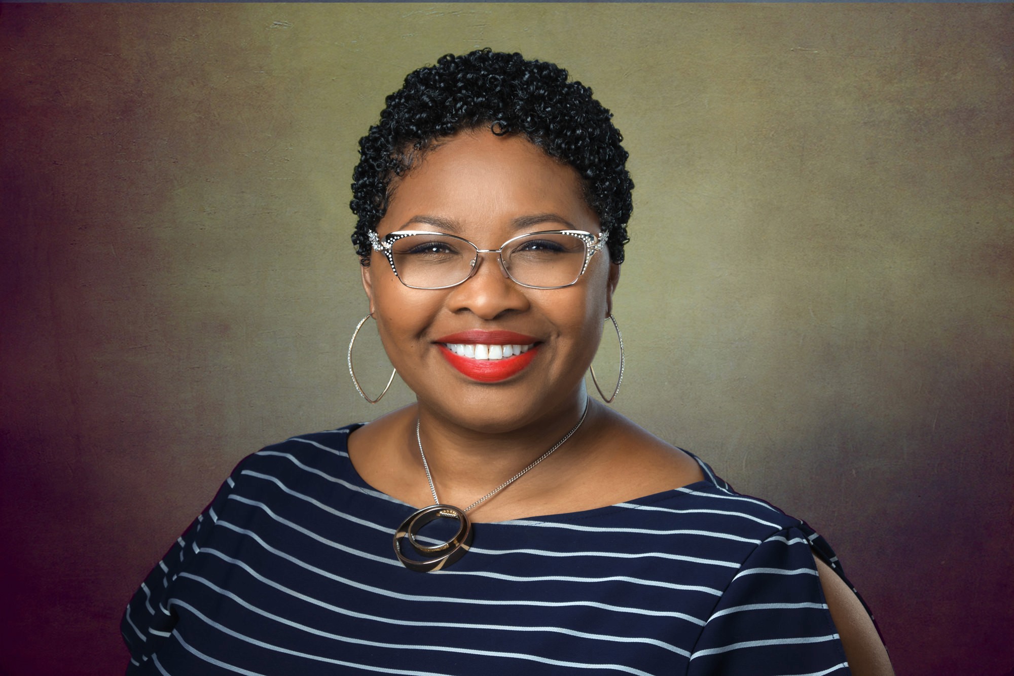 Stylized creative portrait of a woman in a green jacket, blending artistic flair with professional polish. Design leadership photography Oakland.