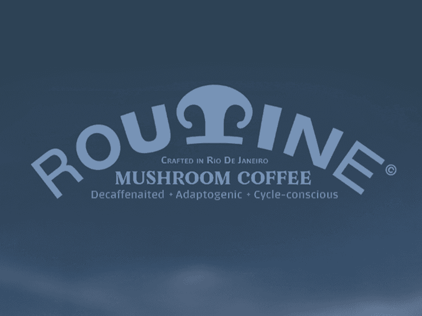 Four diverse professionals collaboratively working on a laptop, with one person pointing at the screen while others observe.