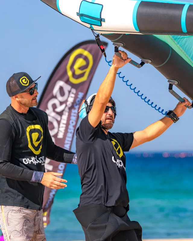 Instructor teaching wing control technique during wing foiling lesson at Explora Watersports Tarifa
