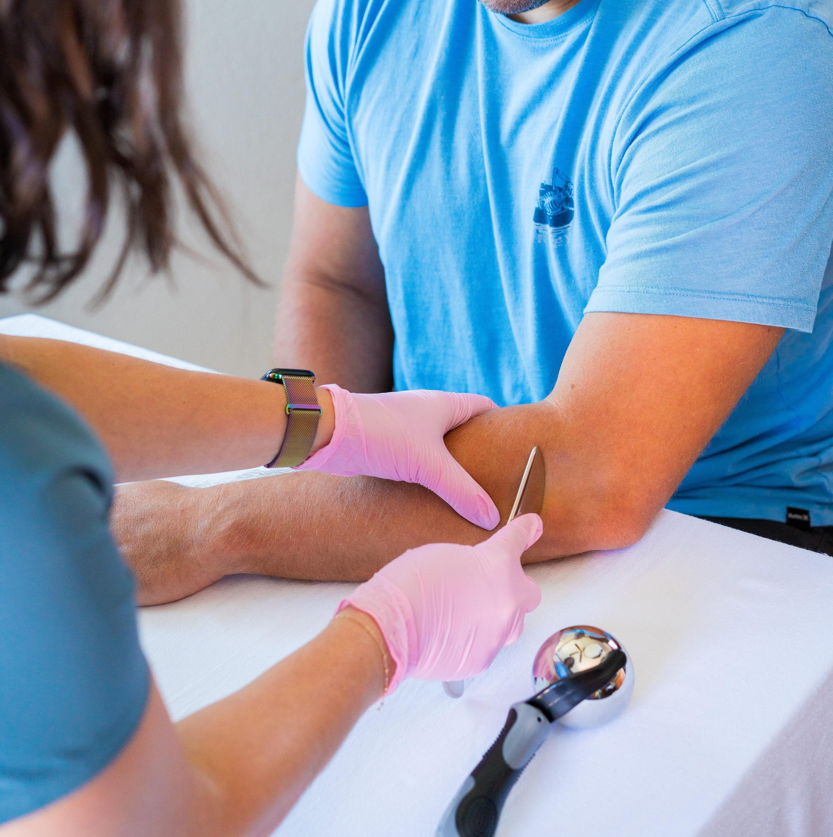 Image of therapist treating elbow tendonitis