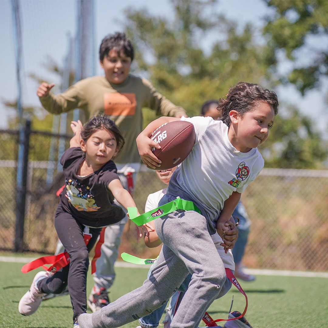 Students engaged in outdoor sports and active play as part of a HOKALI aftercare program.