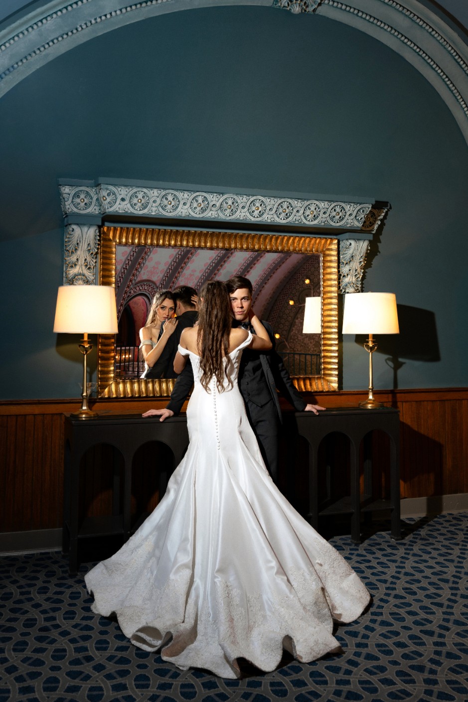 A joyful couple stands together.