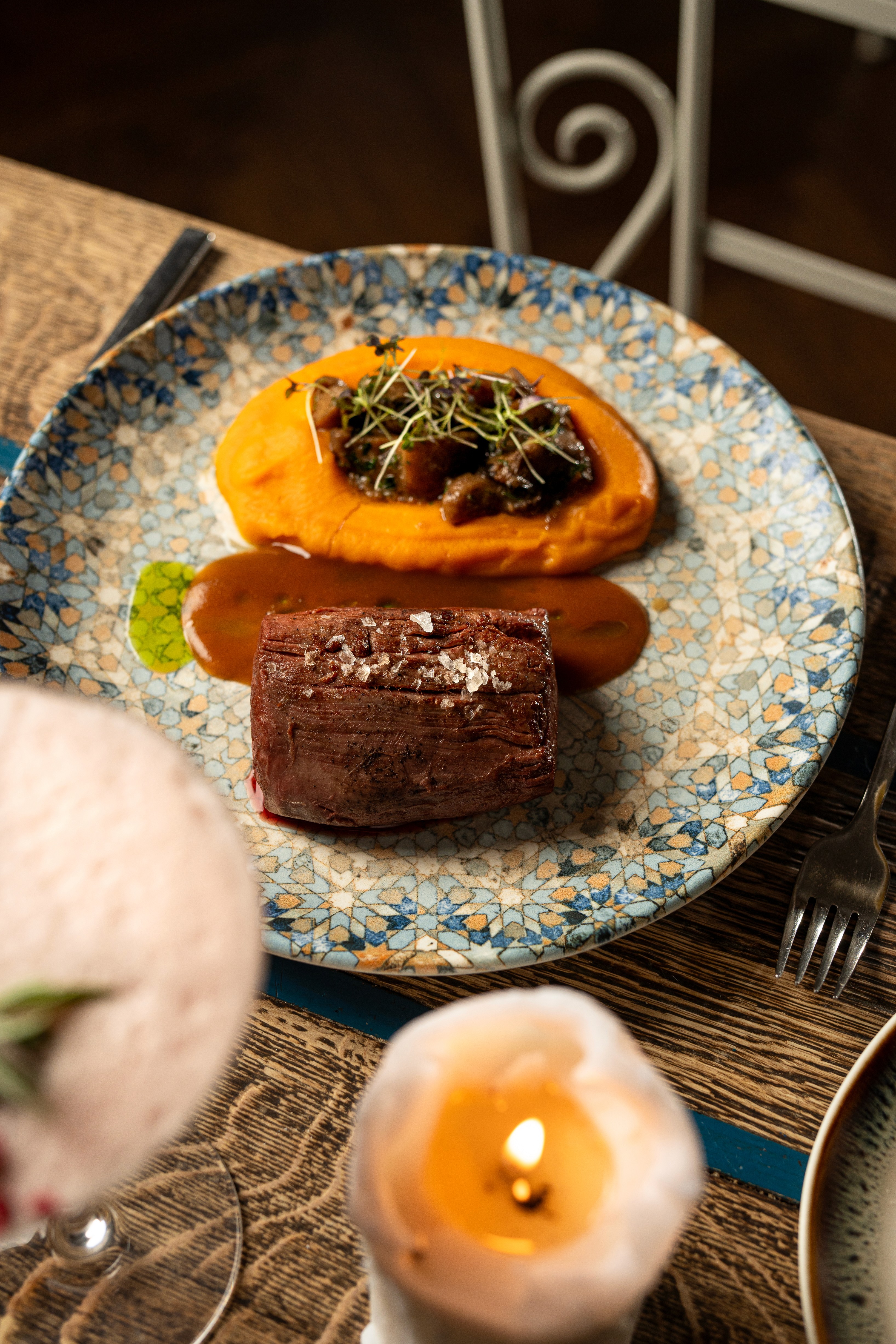 People sharing food at Mazeltov restaurant