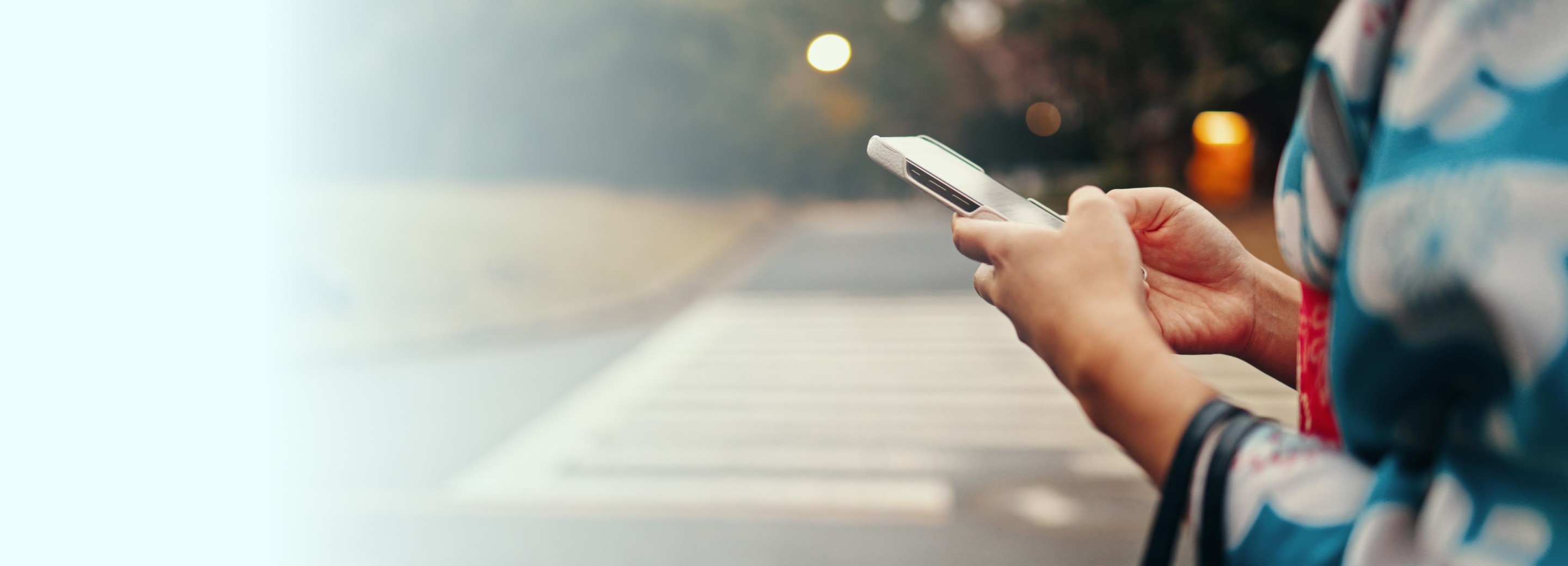A girl in kimono holding a phone