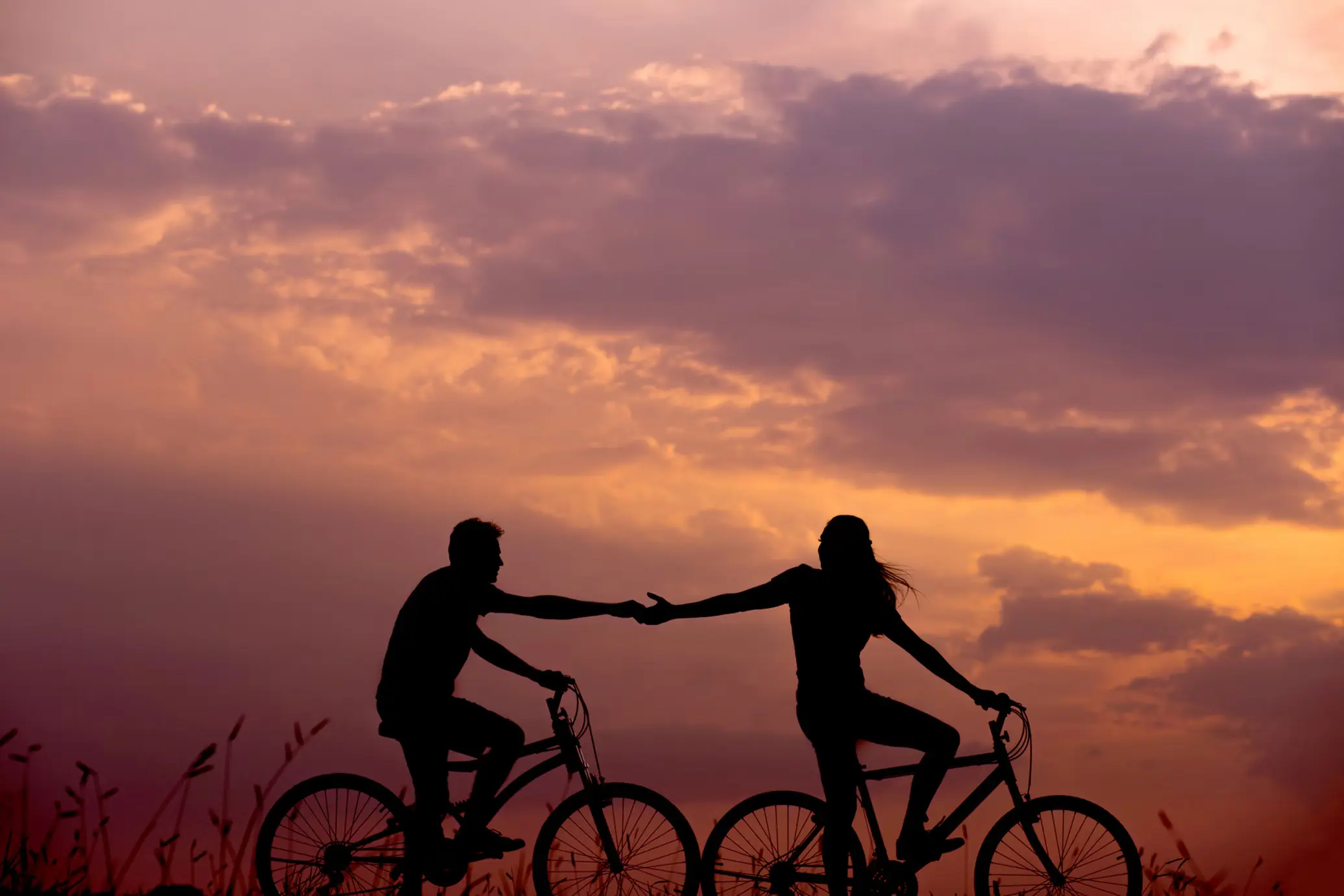 A couple seeking reconnection bike together.