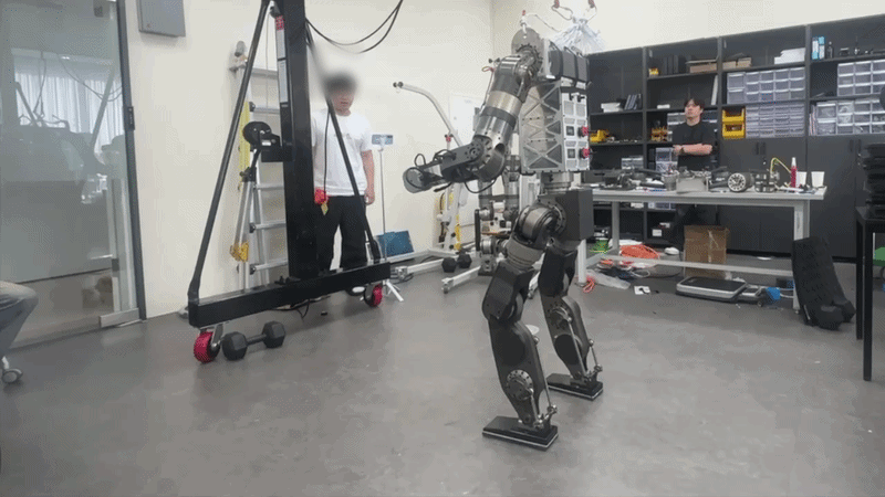 The humanoid walking on two legs. The actuator module and learning pipeline validated on the quadruped carry over into a human-shaped body.