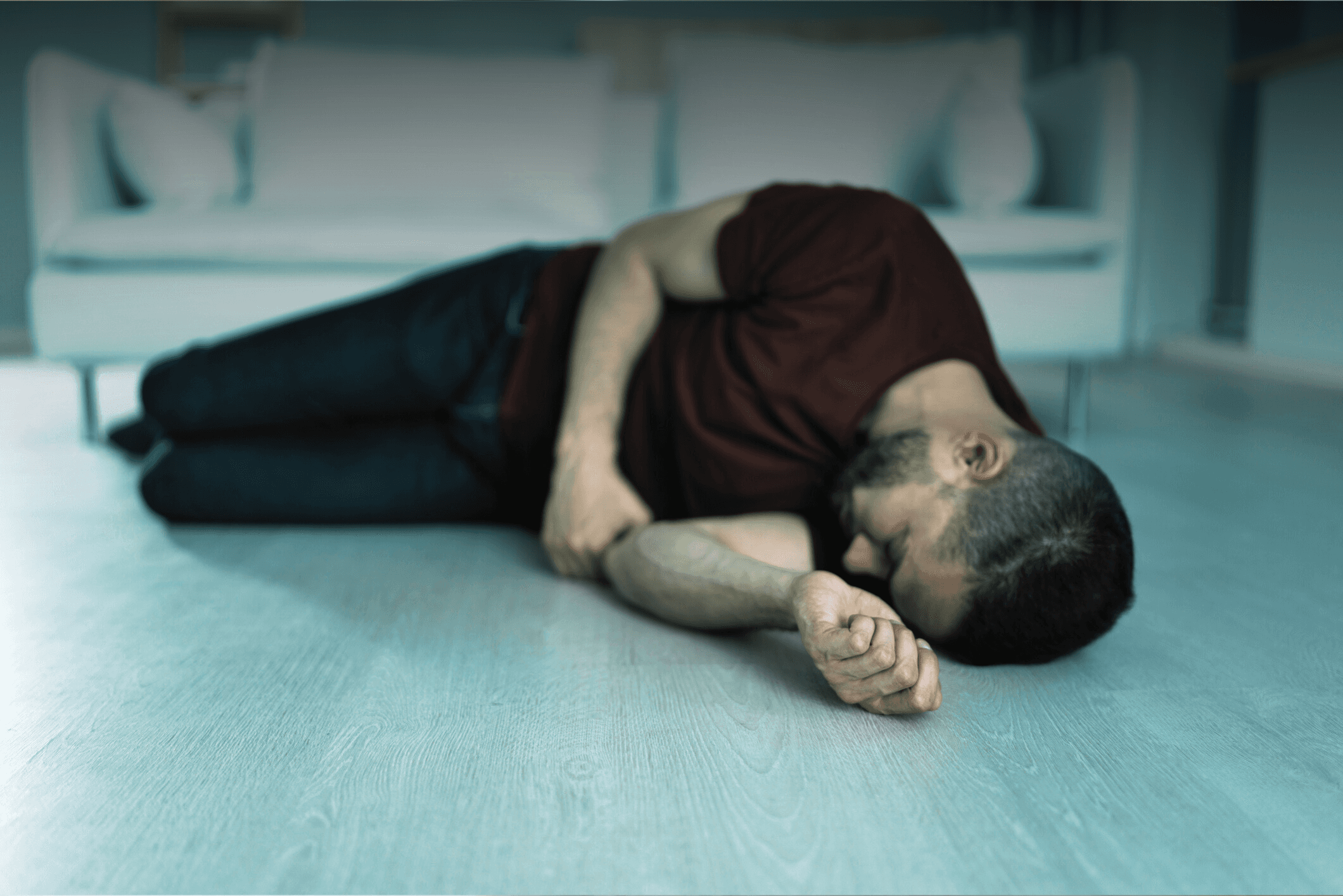 Three people sitting on a couch in a room looking at mobile devices