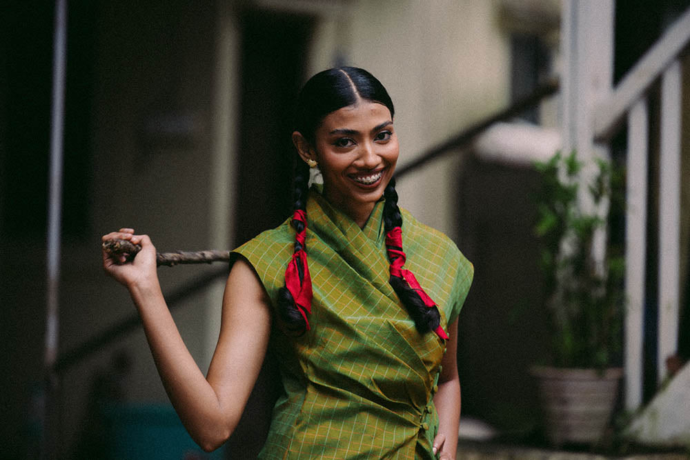 Antrikha asymmetrical silk top with folded neckline and side buttoned flap drape