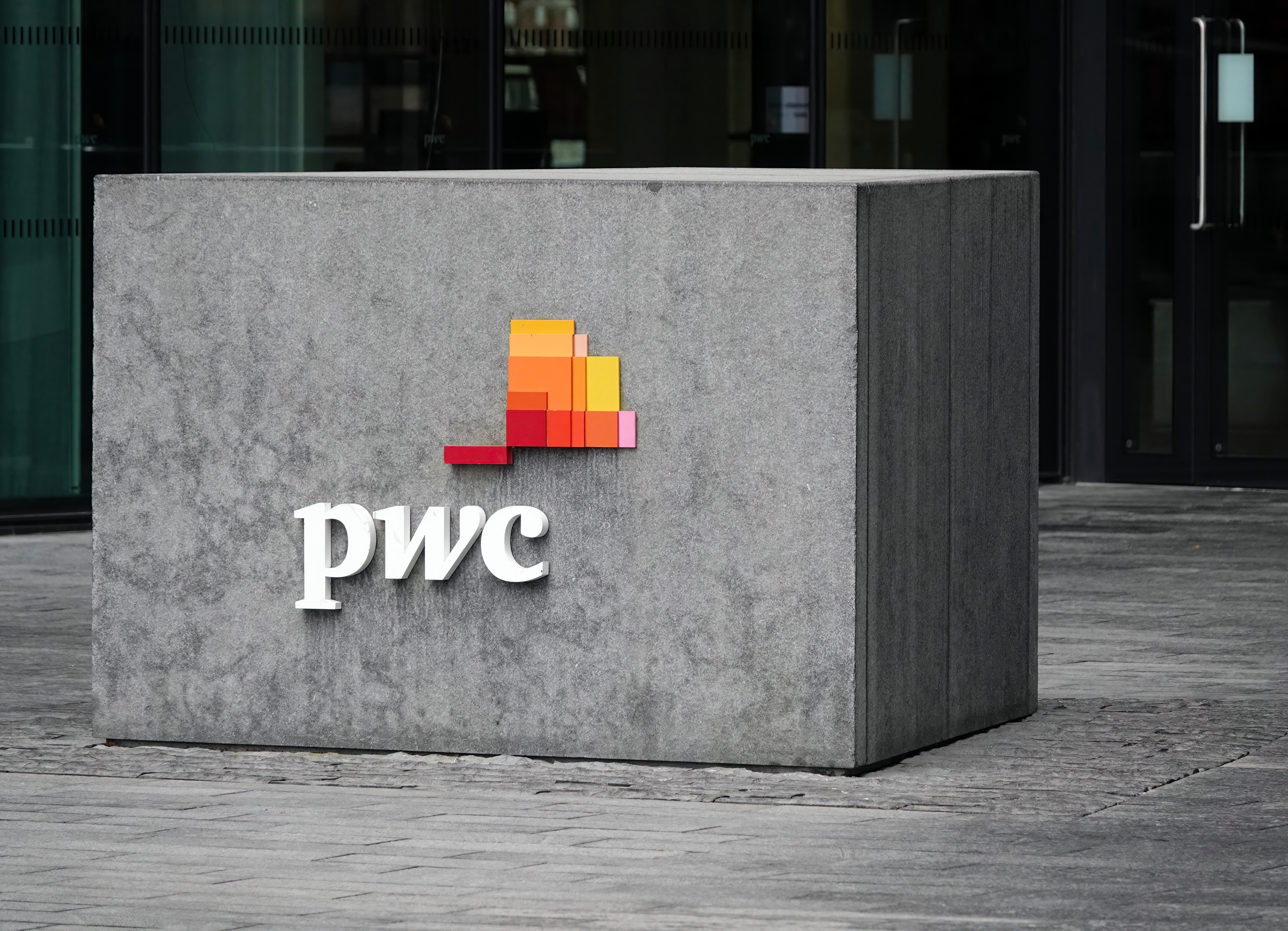 PwC logo on building