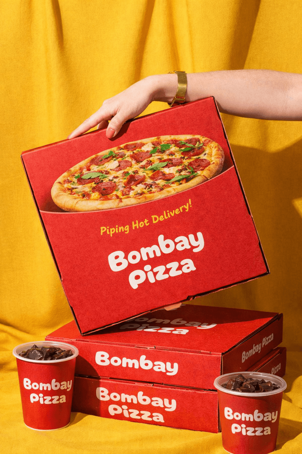 Piping hot Bombay Pizza packed for delivery, part of Central Kitchen’s multi-brand takeaway kitchen in Toronto