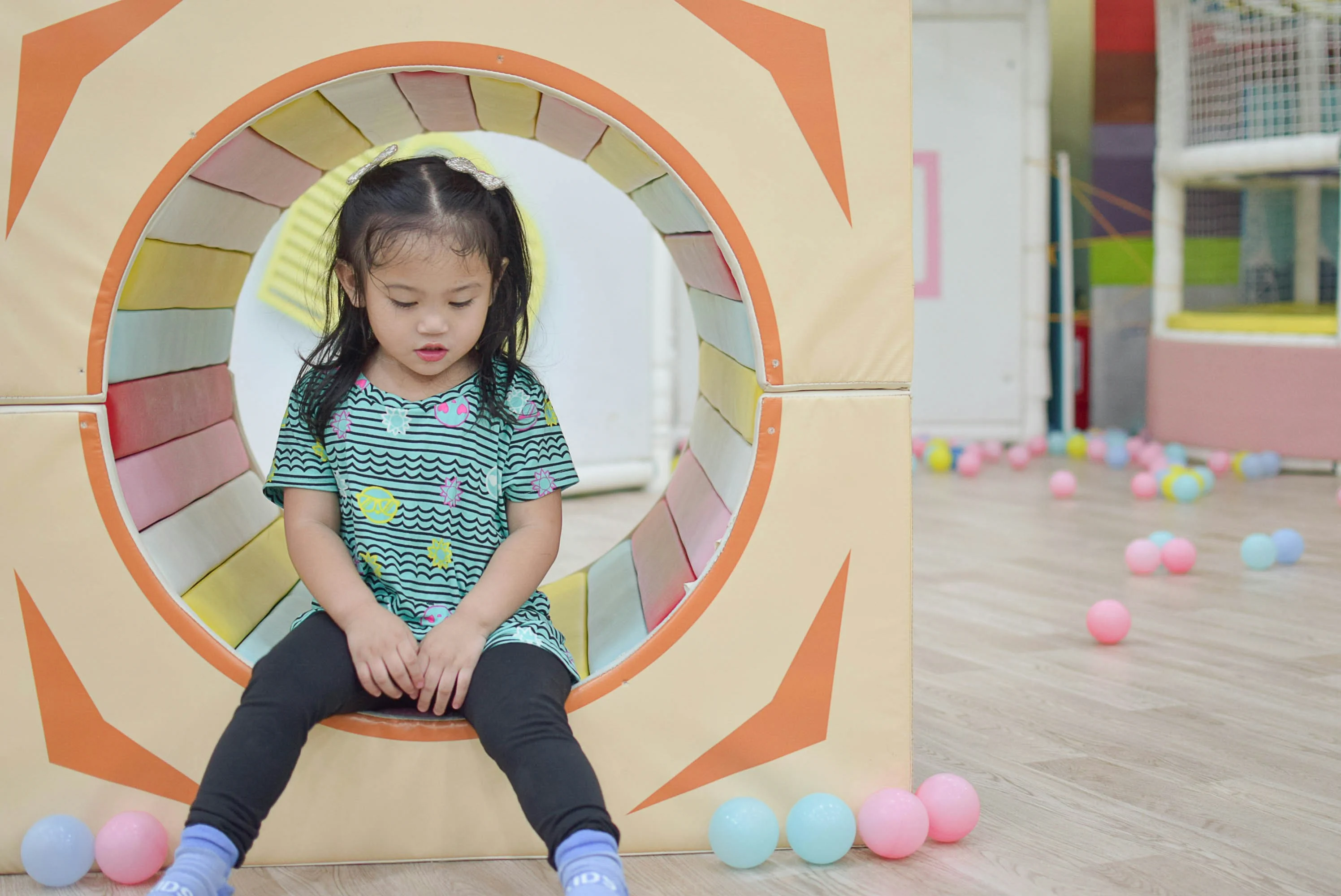 Happy toddlers playing together in a safe and supervised daycare classroom