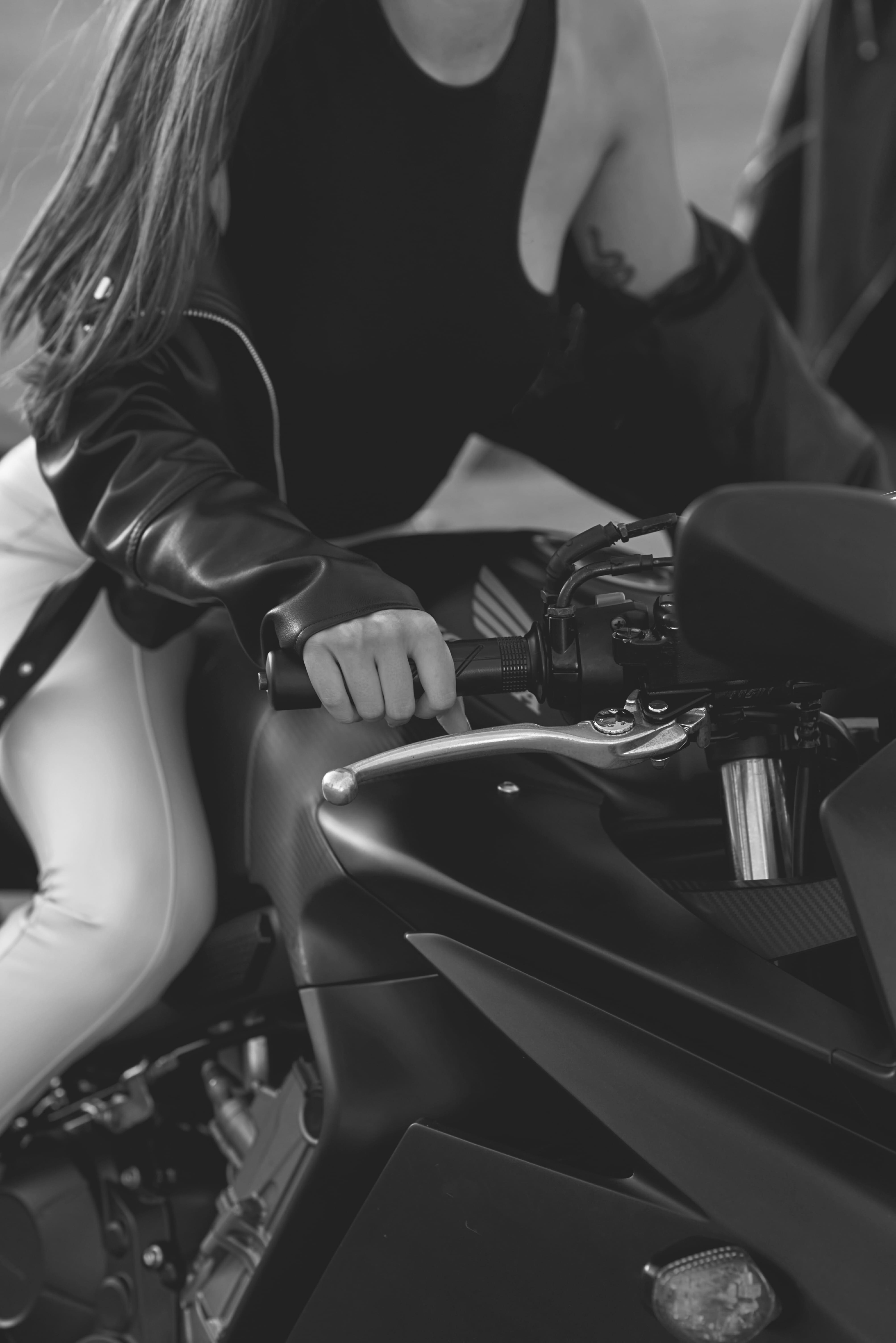 rtf header black and white image close up of a girl riding a sport motorcycle