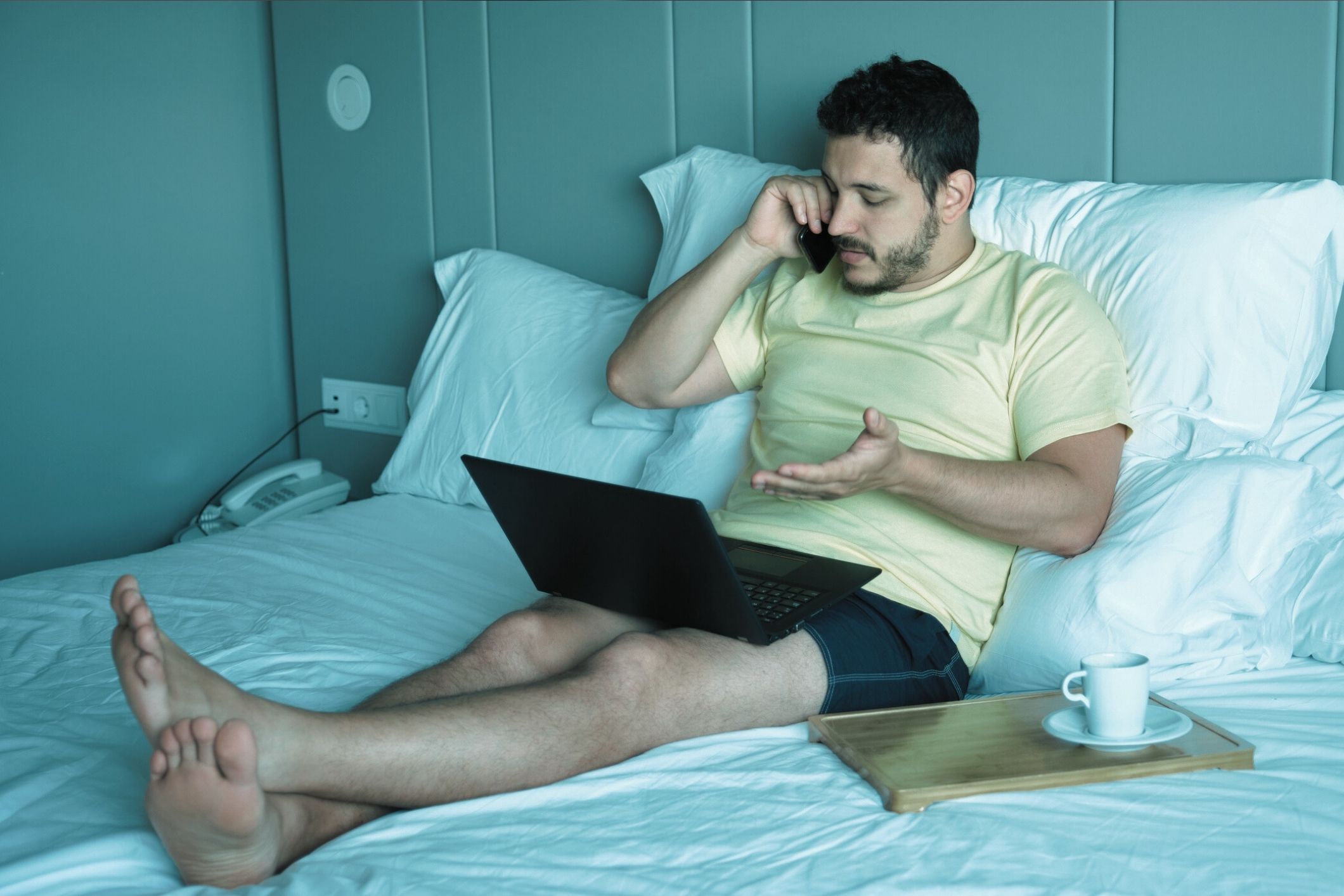 Black cosmetic product bottle against a dark background
