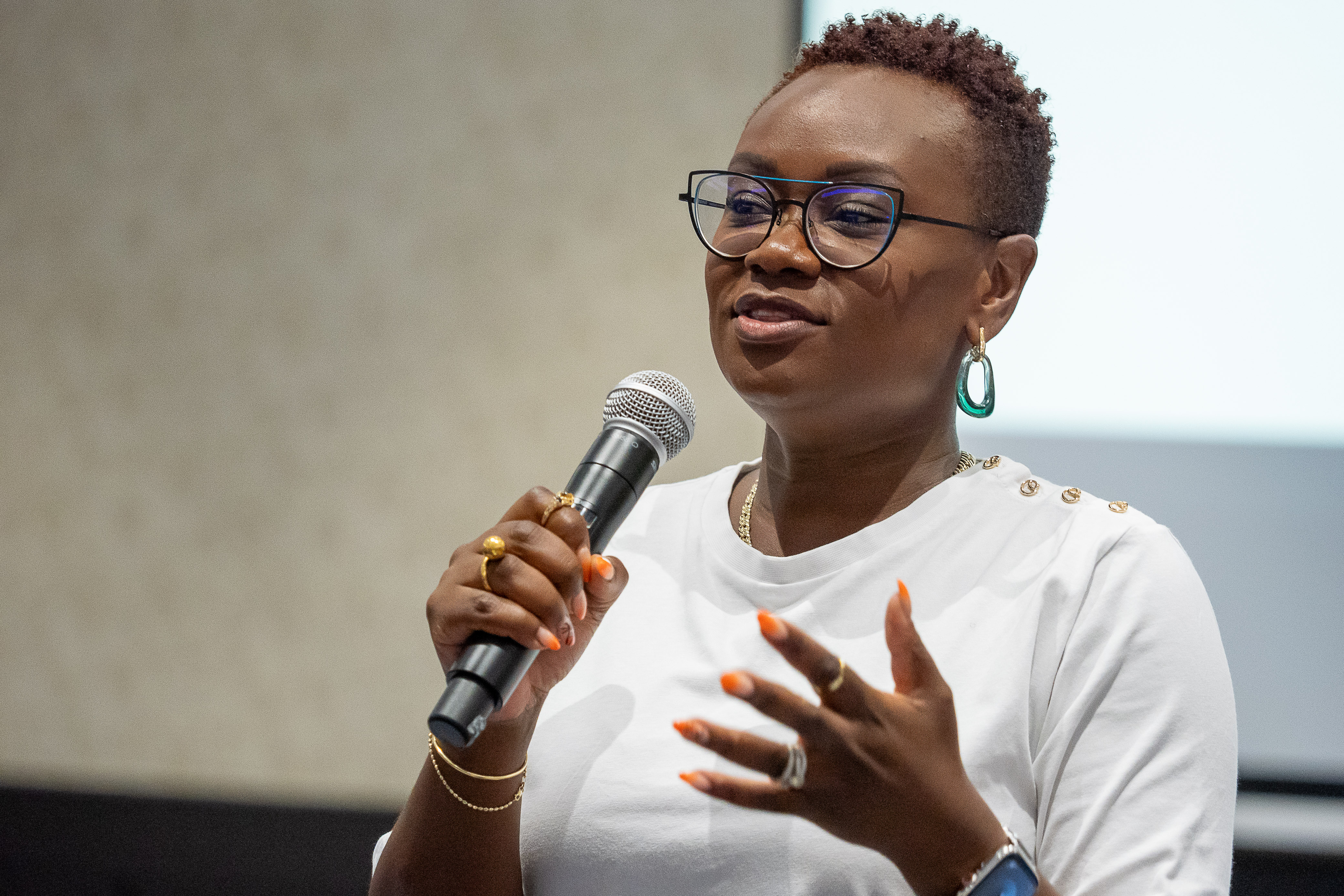 A black woman speaking on the mic