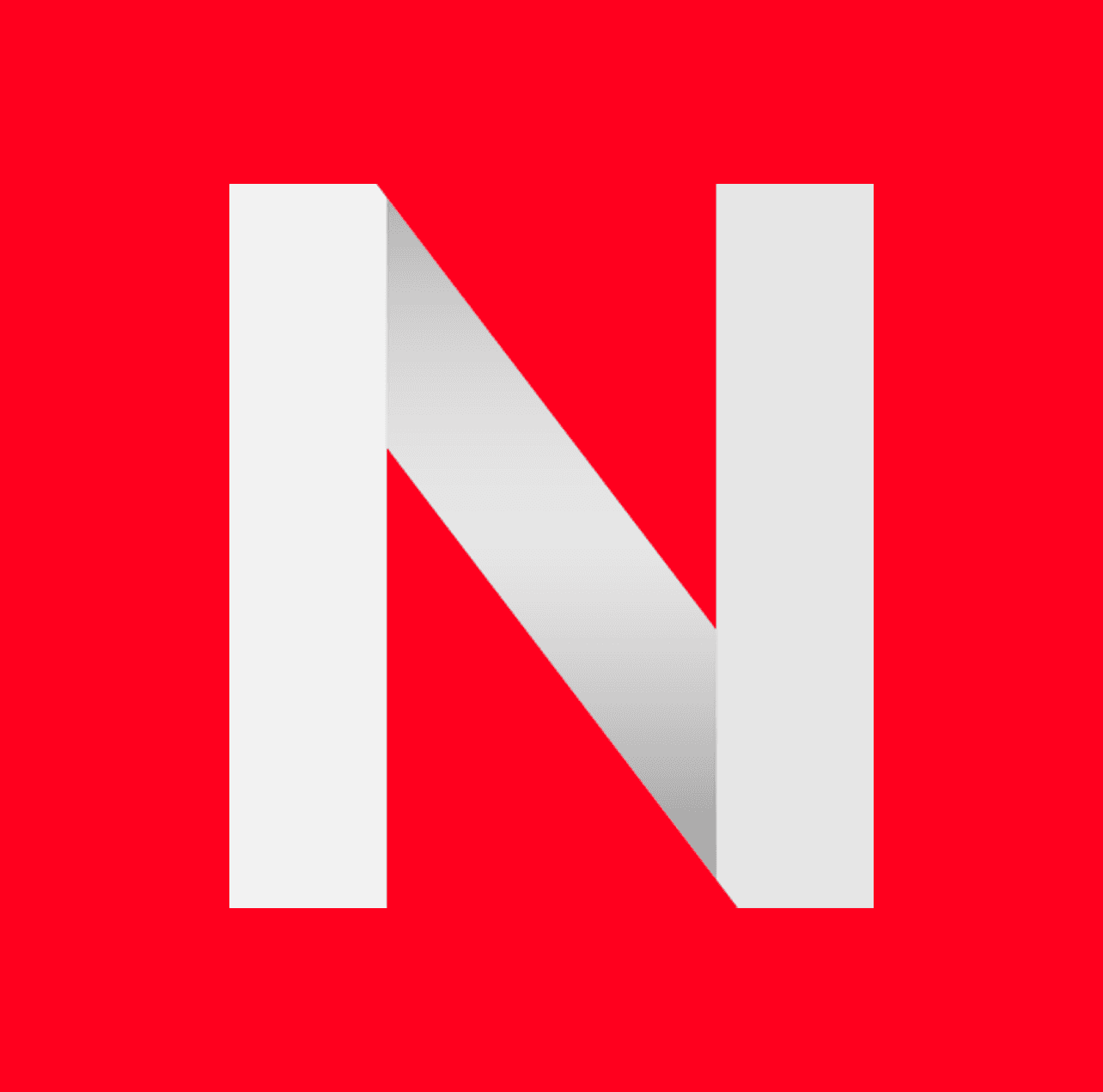 Two women sitting together in a cozy, well-lit workspace, smiling and collaborating over a laptop, with a coffee cup and a bowl on the table.