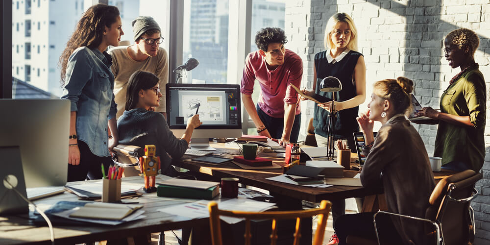 Creative team collaborating around a table in a modern office
