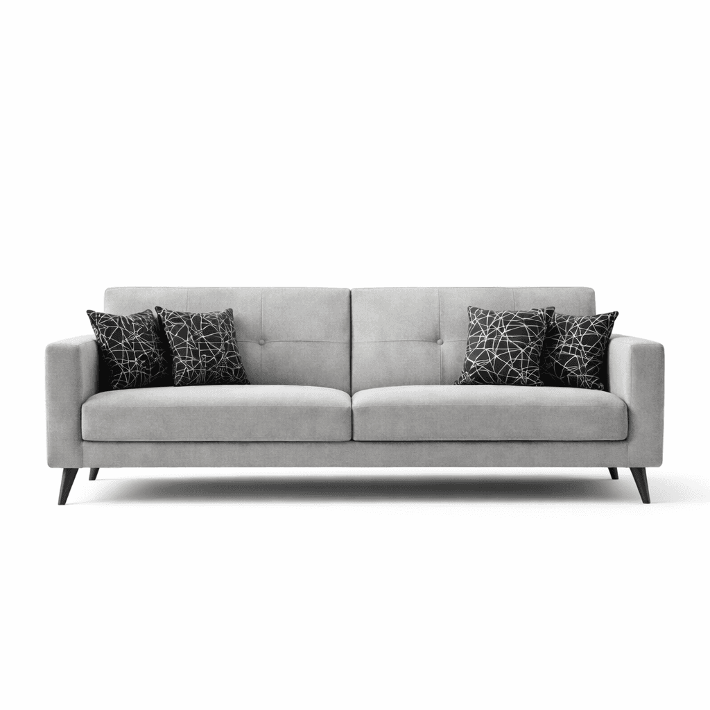 Light grey upholstered seating with button‑tufted backrest, straight arms, tapered wooden legs, and patterned accent cushions