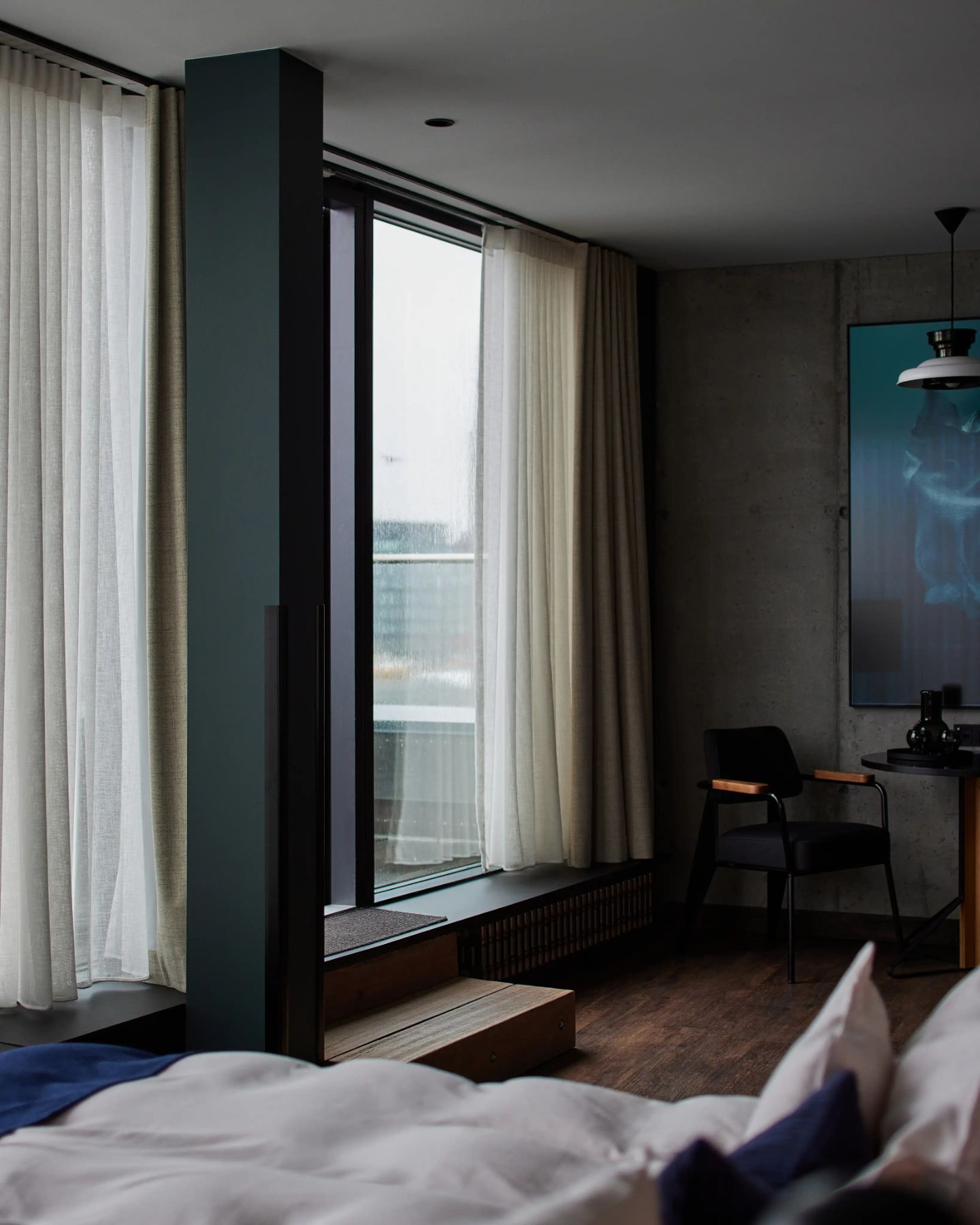Modern guest room at Exeter Hotel in Reykjavík with a workspace and contemporary design.
