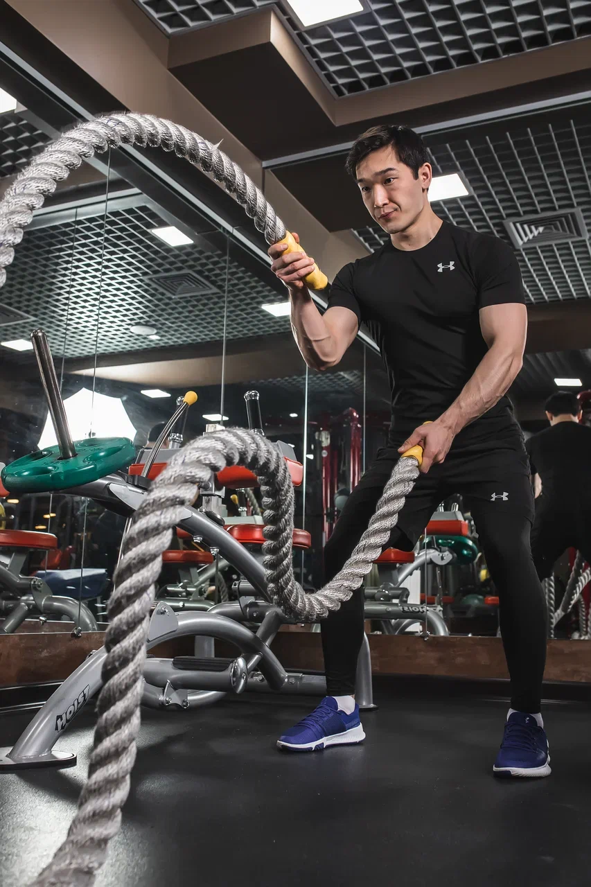Man wearing yellow sweater and white VR headset indoors