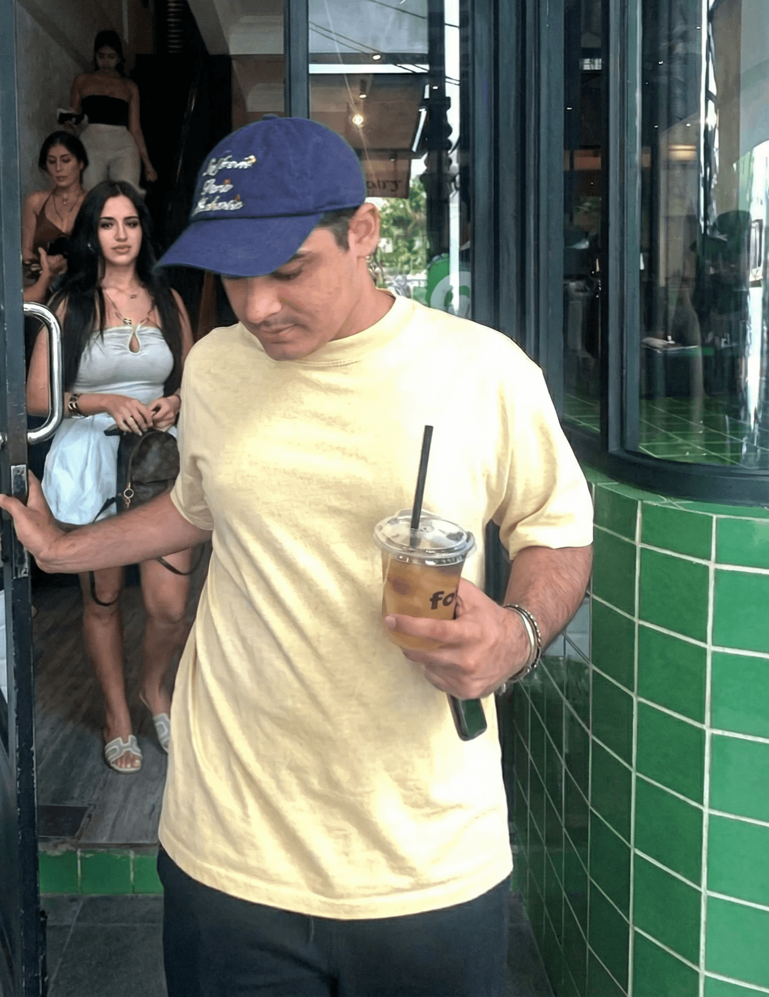 man with glasses smiling fully