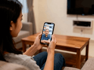 girl in pink tank top sitting on white bathtub