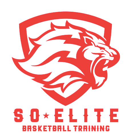 A man in a gray blazer and brown vest, with gray-streaked hair, poses against a neutral background.