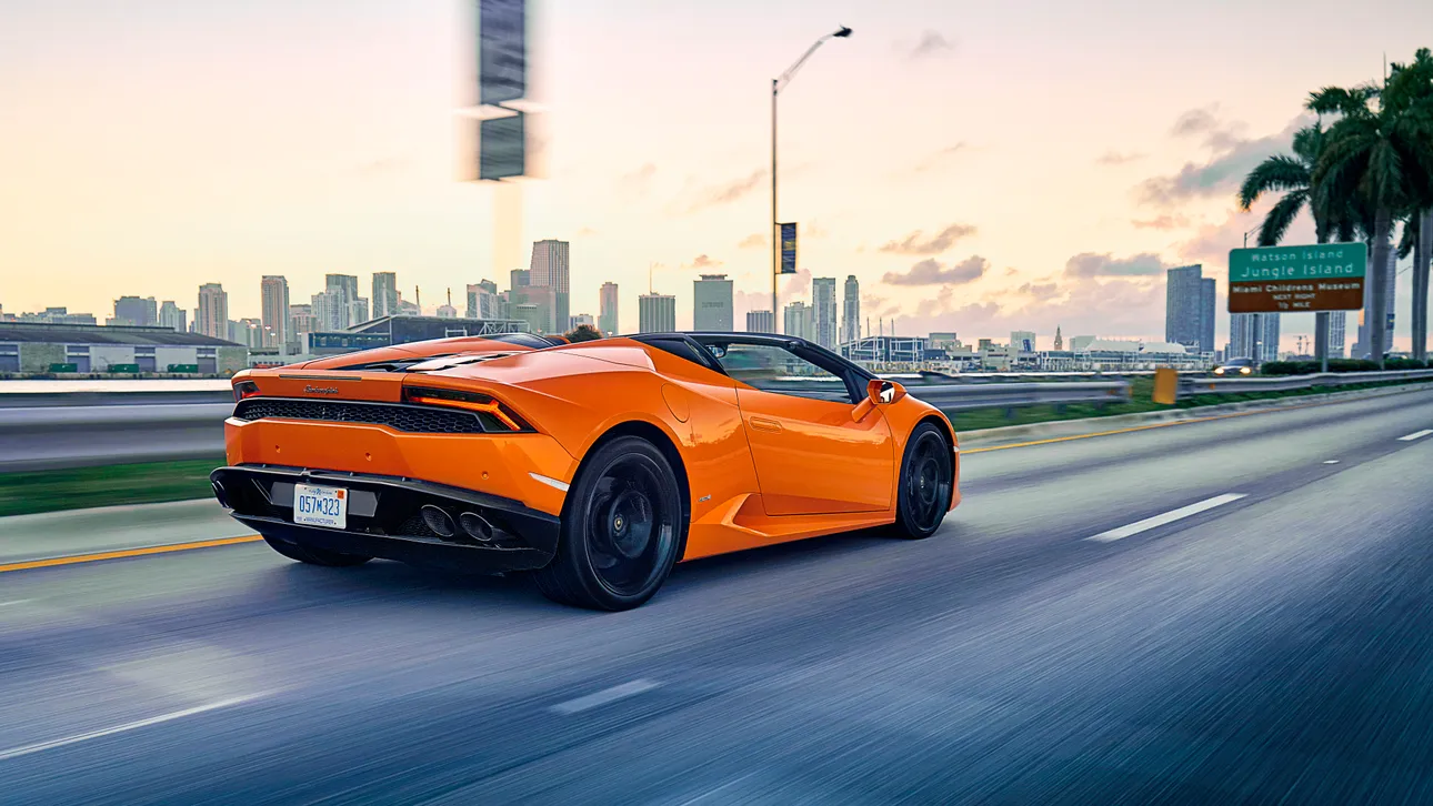 Lamborghini Huracan driving through Miami with Monarc VIP exotic car rental services